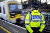 British Transport Police officer on platform as train passes