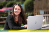 Emma Cross at her laptop