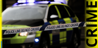 Police car with do not cross tape and CRIME