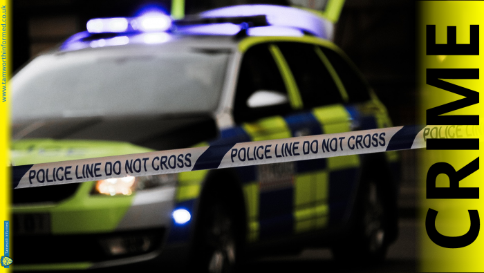 Police car with do not cross tape and CRIME
