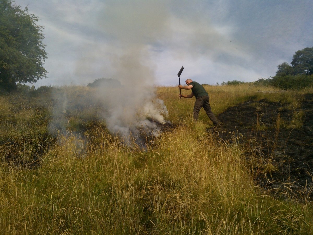 Staffordshire County Council Ranger Dave Oakes fighting a previous grass fire at Deep Hays Country Park.