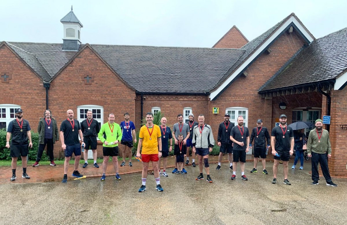 Mark Shanahan (centre) with friends who supported him during his final marathon.